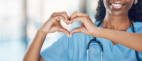Nurse holding hands in heart formation