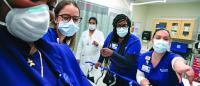 Laura Serna, MS ’23, Belinda Samuda, MS ’23, and Robynn Cheng-Roberts, MS ’23, at Queens Hospital Center, one of four clinical sites included in Columbia Nursing’s new partnership with NYC Health + Hospitals.