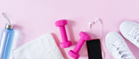 Stock photo with pink dumbbells and fitness equipment
