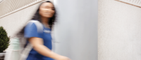 A Columbia Nursing student moving through a blurred pose