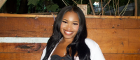 Columbia Nursing student standing with white coat