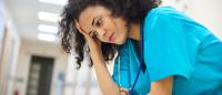 Nurse dealing with stress during shift