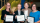 Four individuals holding award certificates